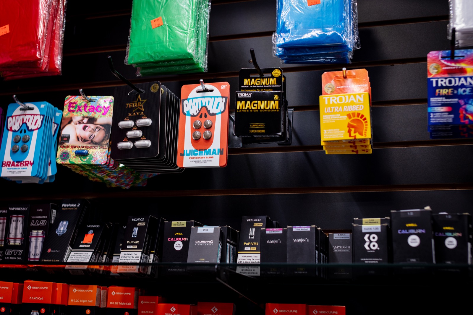 Counter product display with vape coils, pods, and accessories